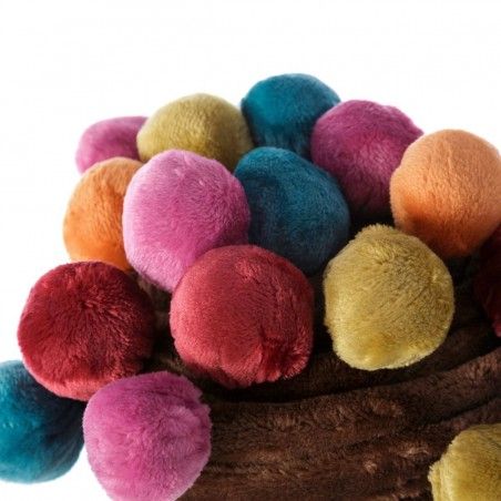 Coperta divano marrone, con un tocco di pesca, con pom-pon di colore