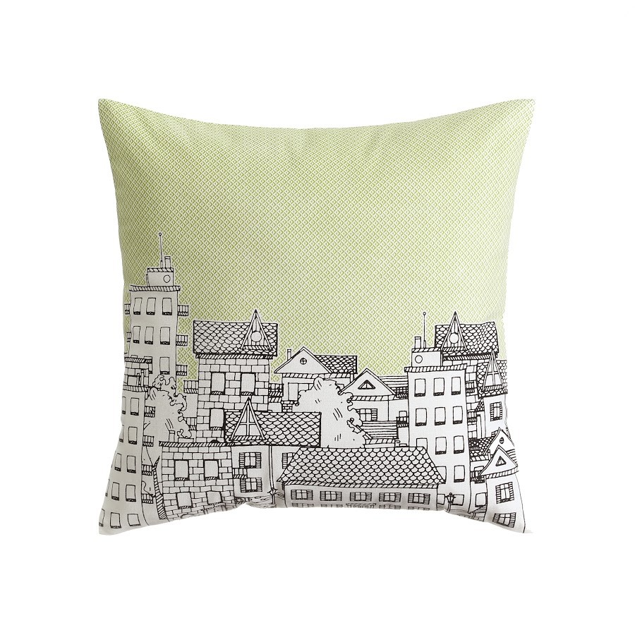 Coussin décoré avec un dessin d'une ville,de vert et de blanc