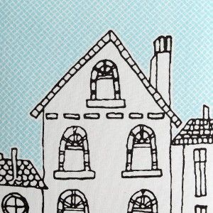 Cushion decorated with a drawing of a city blue and white