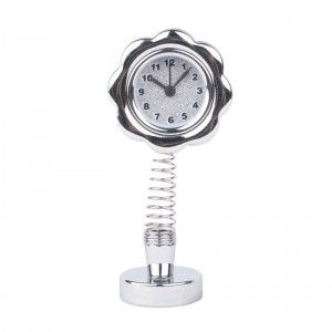 Reloj flor con muelle