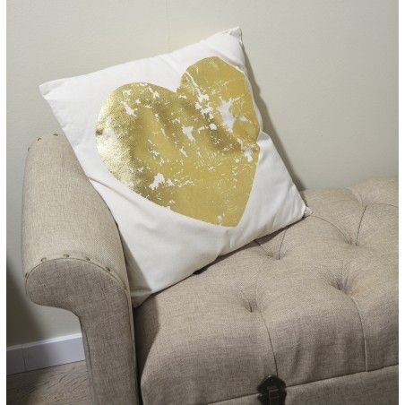 Coussin avec un coeur décoré en or et 